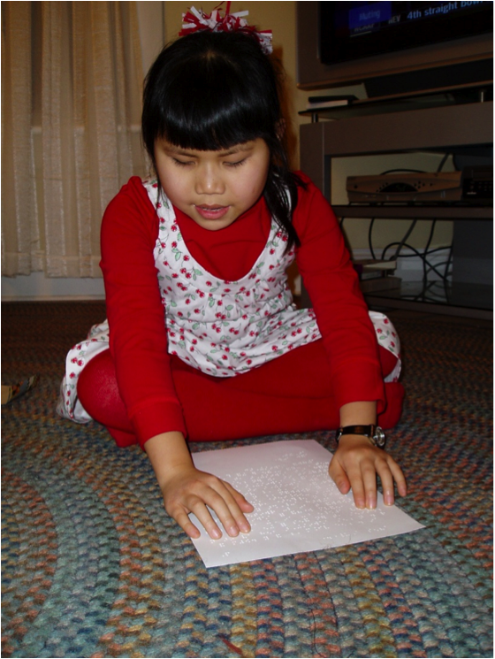 Girl With Braille Letter from Santa